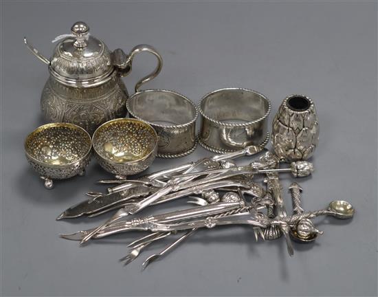 A pair of Indian? white metal salts, Indian mustard pot & spoon, pair of white metal napkin rings & group of plated items.